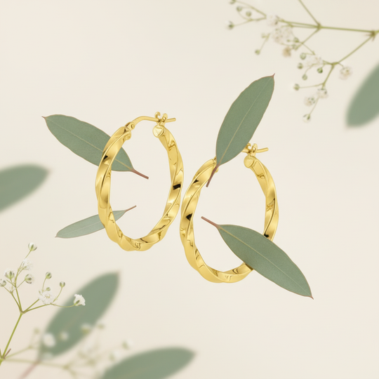 Girella creolen met botanische elementen