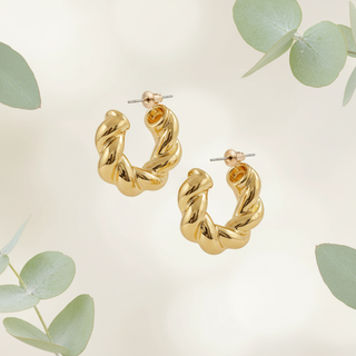 Goud twisted hoops met botanische elementen