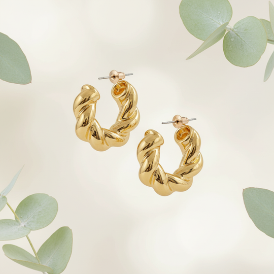 Goud twisted hoops met botanische elementen