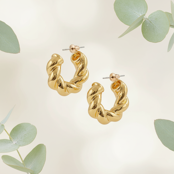Goud twisted hoops met botanische elementen