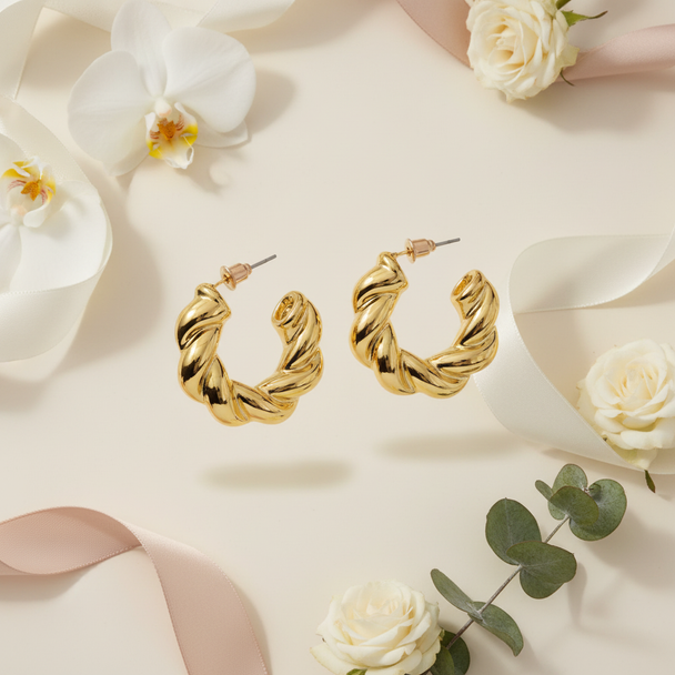 Goud twisted hoops met florale elementen