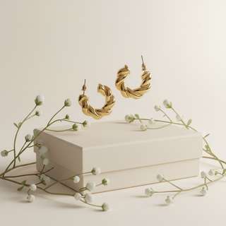 Goud twisted hoops minimalistisch