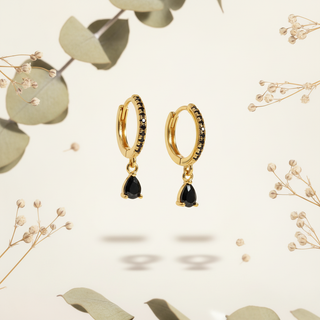 Goud zwarte druppel met botanische elementen