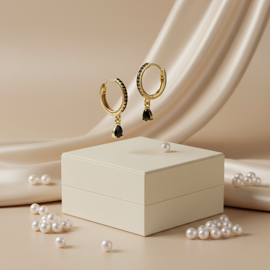 Goud zwarte druppel met parels