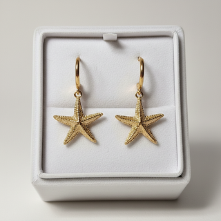 Gouden zeester creool oorbellen in luxe doos - paar