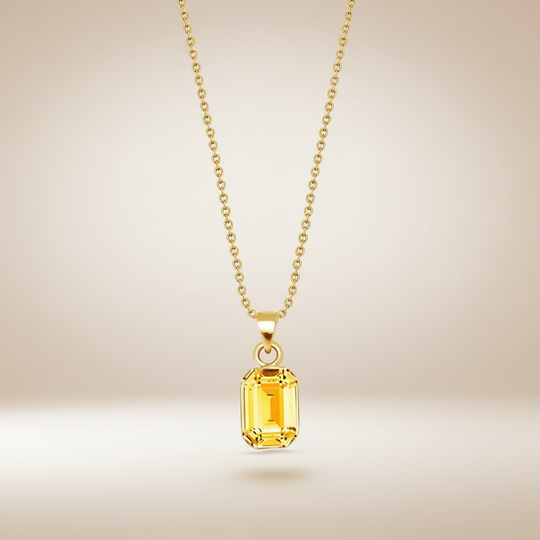 Gouden ketting met gele kristal hanger zwevend