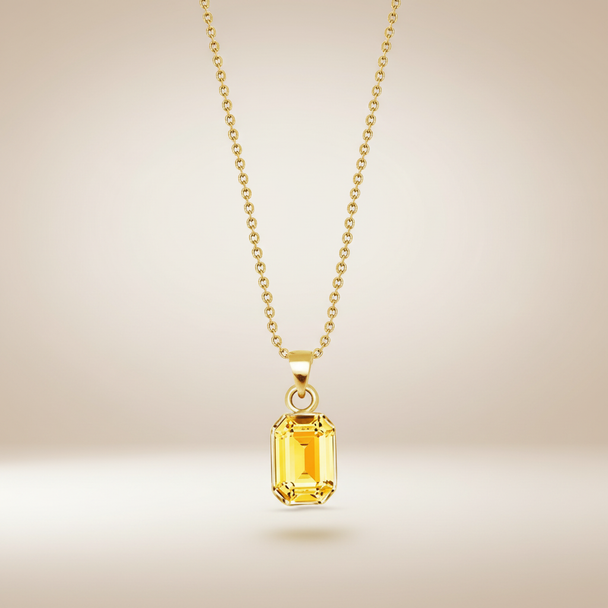 Gouden ketting met gele kristal hanger zwevend