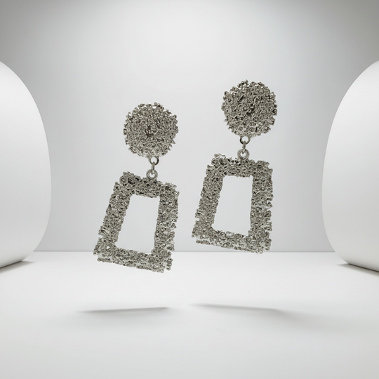 Zilveren statement oorbellen zwevend