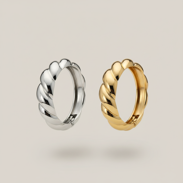 Zwevende chunky twisted armbanden zilver en goud