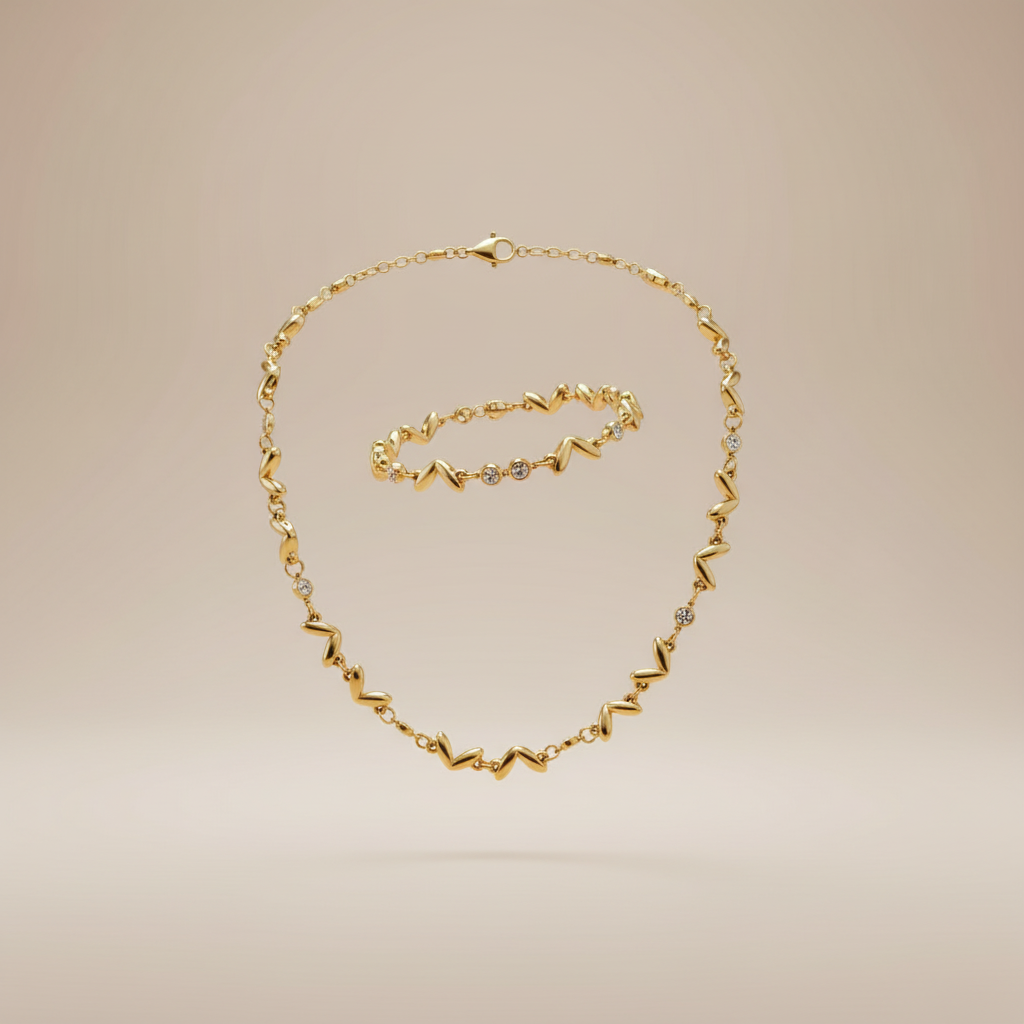 Zwevende zigzag wave ketting en armband set goud