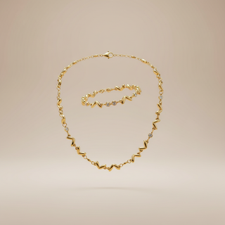 Zwevende zigzag wave ketting en armband set goud