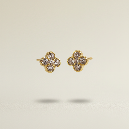 Gouden klaver oorknopjes zwevend