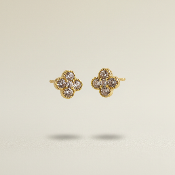Gouden klaver oorknopjes zwevend