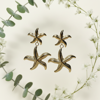 Zeester oorbellen met botanische elementen