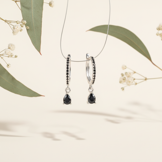 Zilver zwarte druppel met botanische elementen